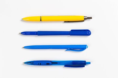 Collection of multi-colored ballpoint pens isolated on a whiteの写真素材
