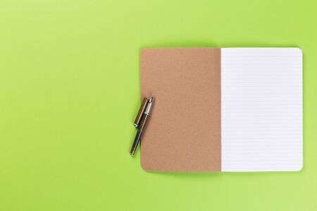 Sketchbook on colorful background. Copy space. top view of blank open notebook, concept of education or new workplaceの写真素材