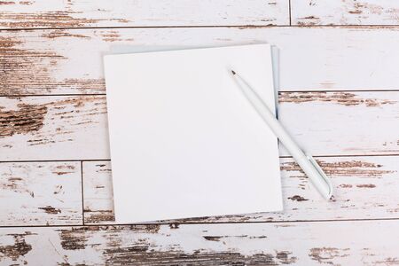 blank notebook with pen on a wooden table, business concept concept of a new workplace
