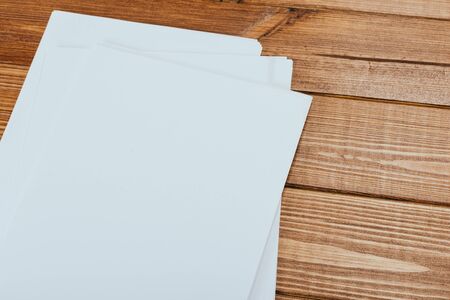 Top view of modern desk office workplace with  a4 paper. Blank branding template. Photo blank form....