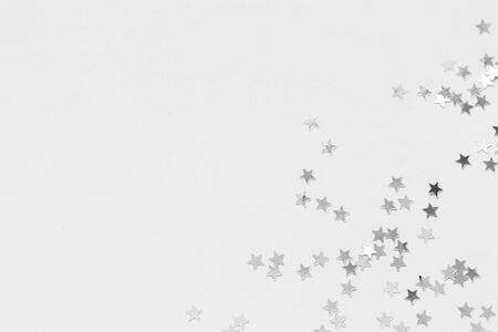 Silver sweets in the form of stars, glitter isolated on white background merry christmas party...