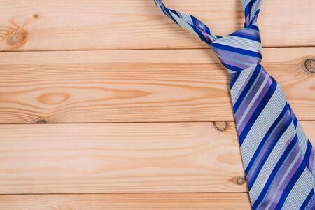 color male tie on a wooden table. shopping conceptの写真素材