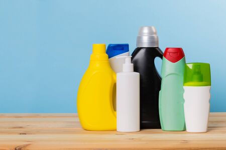 set of cleaning products for house clean on the table on a blue background.