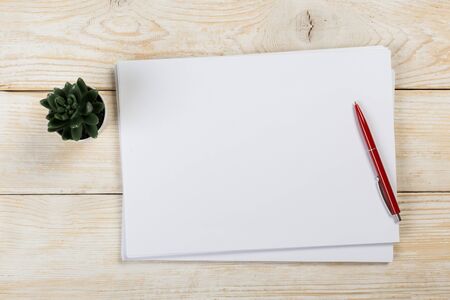Top view of modern desk office workplace with  a4 paper. Blank branding template. Photo blank form....