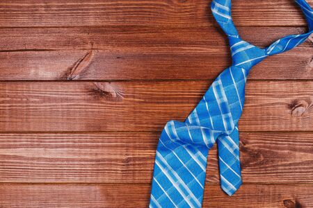 color male tie on a wooden table. shopping conceptの写真素材