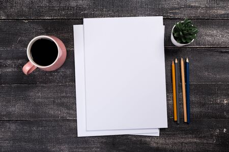 Top view of modern desk office workplace with  a4 paper. Blank branding template. Photo blank form....