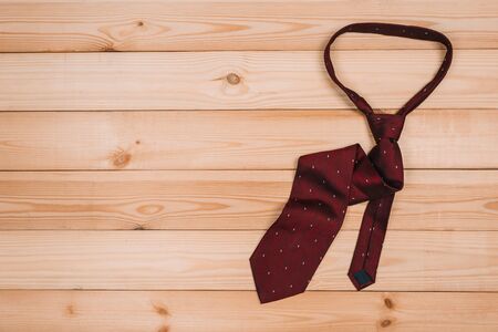 color male tie on a wooden table. shopping conceptの写真素材