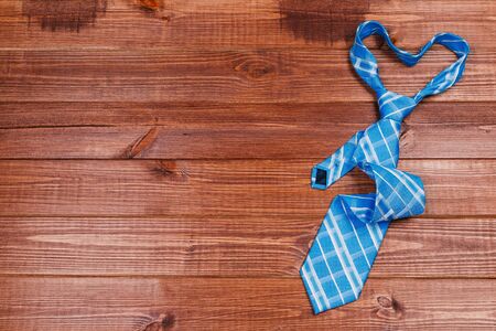 color male tie on a wooden table. shopping conceptの写真素材