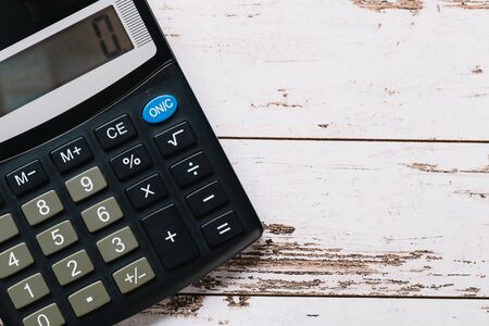 black calculator, Business and Finance accounting concept on wooden tableの写真素材