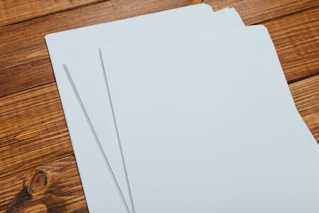 Top view of modern desk office workplace with  a4 paper. Blank branding template. Photo blank form....