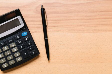 black calculator, Business and Finance accounting concept on wooden table