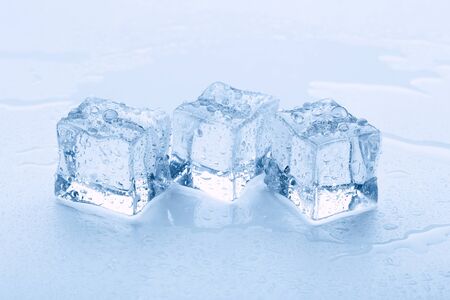 Melted ice cubes close up isolated on white backgroundの写真素材