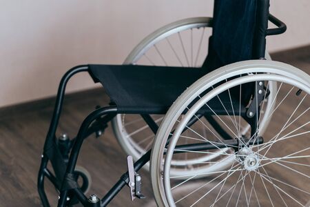 empty wheelchair in the living room. Recovery and healthcare concepts.の写真素材