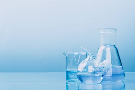 Laboratory glassware with a pipette and test tubes. scientific laboratory equipment