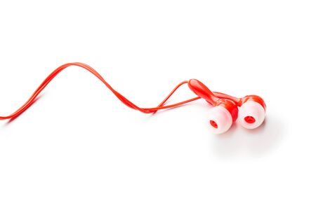 Modern wired classic red headphones isolated on white Modern technology conceptの写真素材