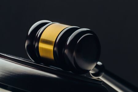 Judge's gavel on a black table. Concept of law