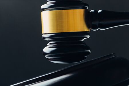 Judge's gavel on a black table. Concept of law