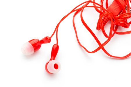 Modern wired classic red headphones isolated on white Modern technology conceptの写真素材
