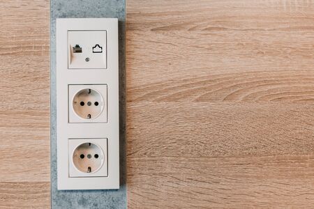 modern white plastic sockets in an office room