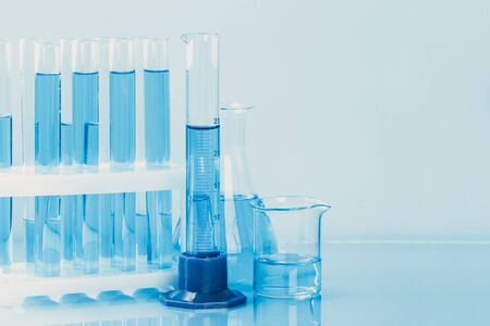 Laboratory glassware with a pipette and test tubes. scientific laboratory equipment