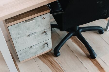Locked desk locker in a modern office. security conceptの写真素材
