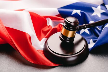 Judge gavel on the background of the flag united states of Americaの写真素材