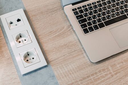 modern white plastic sockets in an office room