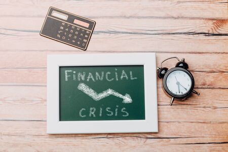 Crisis management of the global economy and stock markets, the concept of the financial crisis. graphics on chalk boardの写真素材