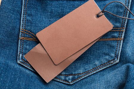Clothing tag, label blank mockup on a clothes, to place your design.  fashion, people and shopping...