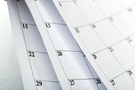 Closes a calendar page in blue. flipping calendar