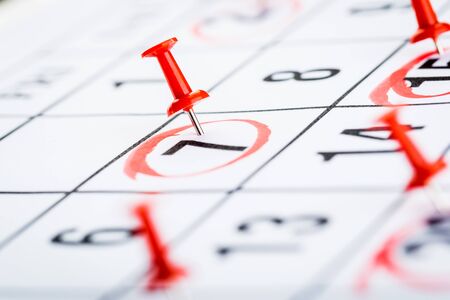 2020 calendar page marked with an important date in red pin. timeline, time, concept, idea, management, backgroundの写真素材