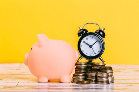 pink piggy bank on a yellow background, space for text. Finance, saving money, crisis. Business or Retirement Savingsの写真素材