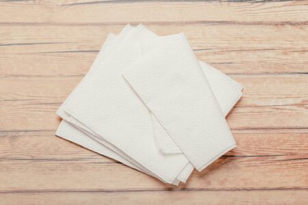 white paper napkin with a textured pattern on an old table