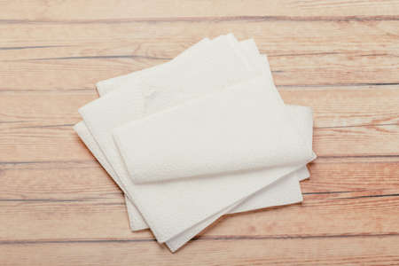 white paper napkin with a textured pattern on an old tableの写真素材