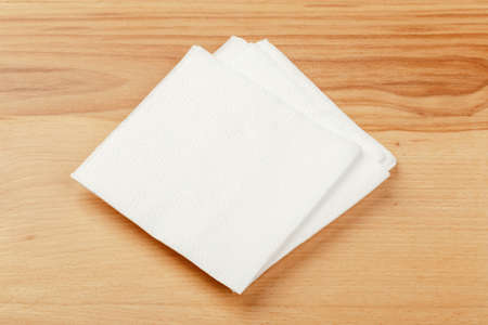 white paper napkin with a textured pattern on an old table