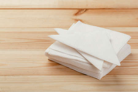 white paper napkin with a textured pattern on an old tableの写真素材
