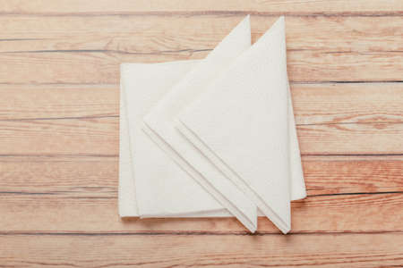 white paper napkin with a textured pattern on an old tableの写真素材