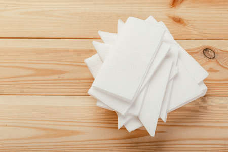 white paper napkin with a textured pattern on an old tableの写真素材