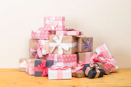 Christmas gift boxes on bokeh light background. Holiday Greeting Card.