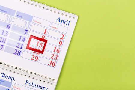 Open calendar on the table with green background, planning a business meeting or travel planning...