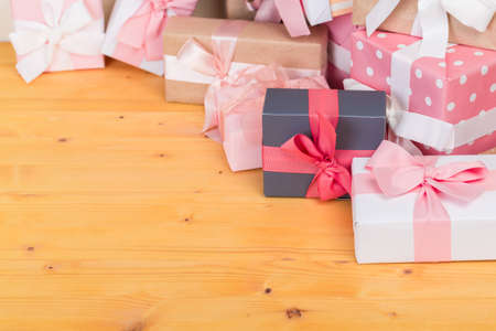 Christmas gift boxes on bokeh light background. Holiday Greeting Card.