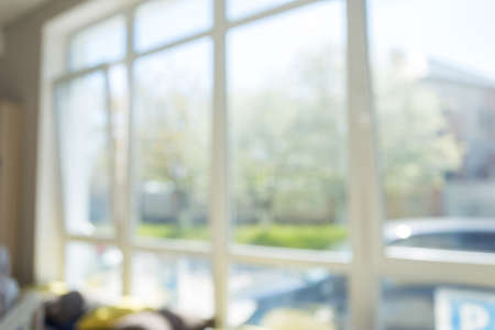 large window with sunlight in the bluer. background for designの写真素材