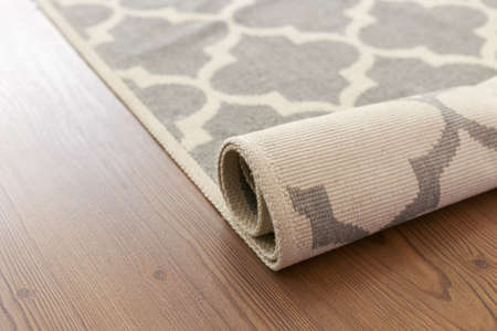 Close-up carpet on laminate wood floor in living room, interior decorationの写真素材