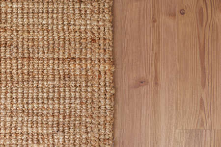 Close-up carpet on laminate wood floor in living room, interior decoration
