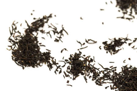 Fragrant Leaves of black premium dry tea on a white background
