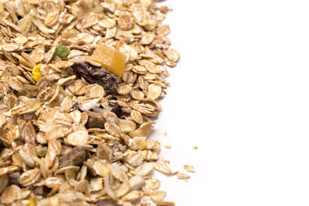 oatmeal with raisins, coconut, pineapple and banana slices isolated on a white background. For packaging design of oatmeal or granola.の写真素材