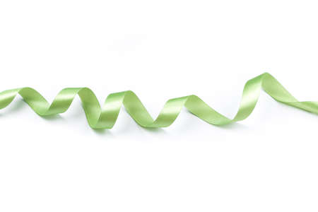 beautiful green satin curly ribbon isolated on white backgroundの写真素材