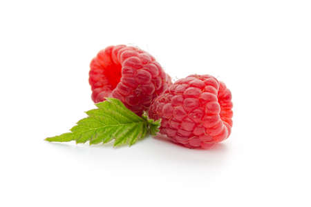 Ripe raspberries with leaf isolated on a white background