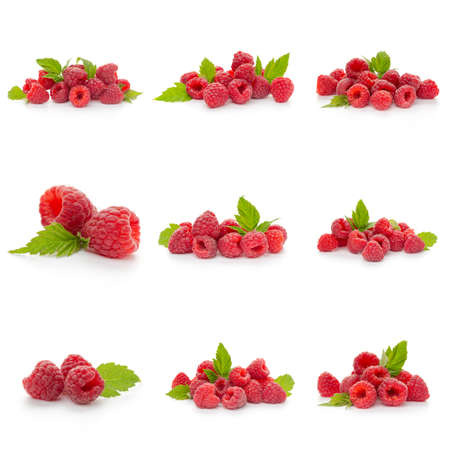 Set of fresh sweet raspberries and green leaves on white background