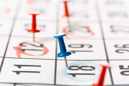 Push pins on calendar. Idea concept of to do planning.の写真素材